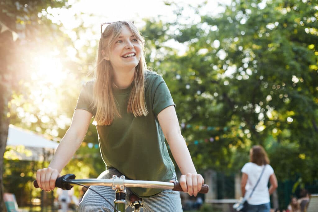 A woman with keratoconus enjoys biking without glasses.