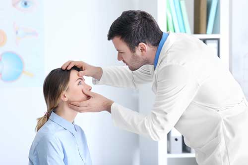 Eye Doctor examining patient