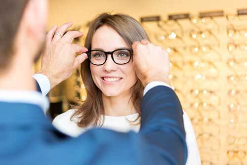 Woman buying new glasses