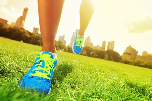 Runner with bright sneakers in urban park