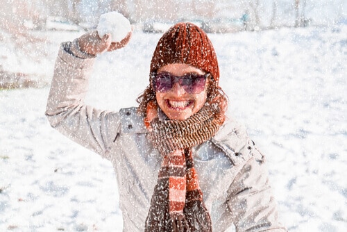 Woman throwing snowball