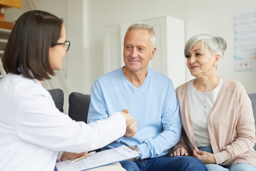 Older couple meeting with medical professional