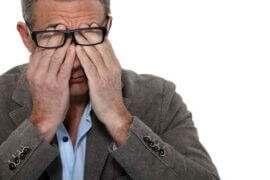 Man rubbing his eyes