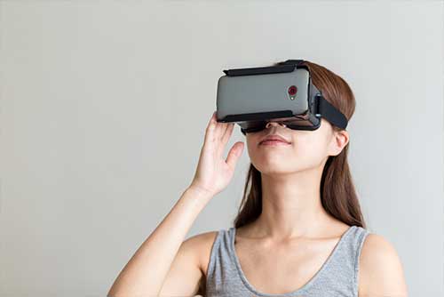 Woman with Virtual Reality headseat