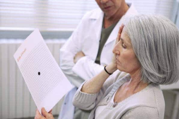 Woman testing for macular degeneration